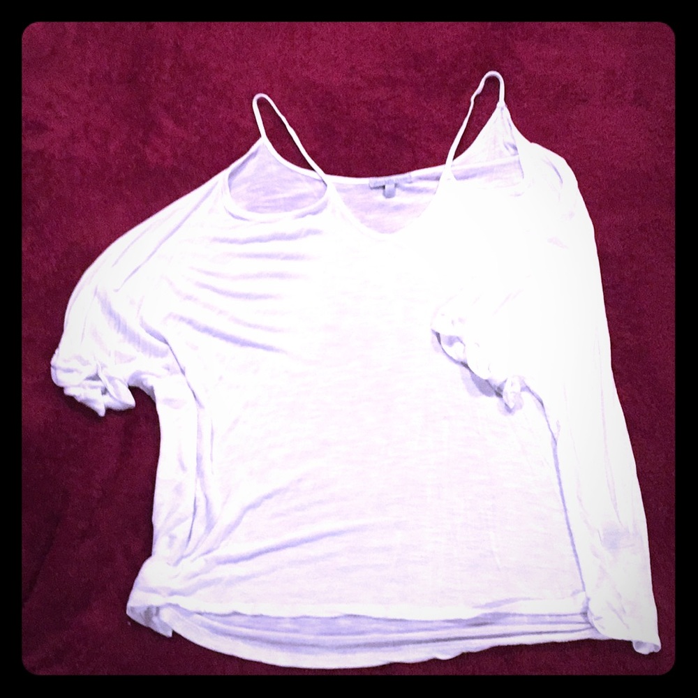 white loose-fitting, off the shoulder, shirt.